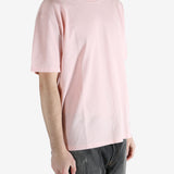 Pink t-shirts worn by a person, showing the shirt's fit