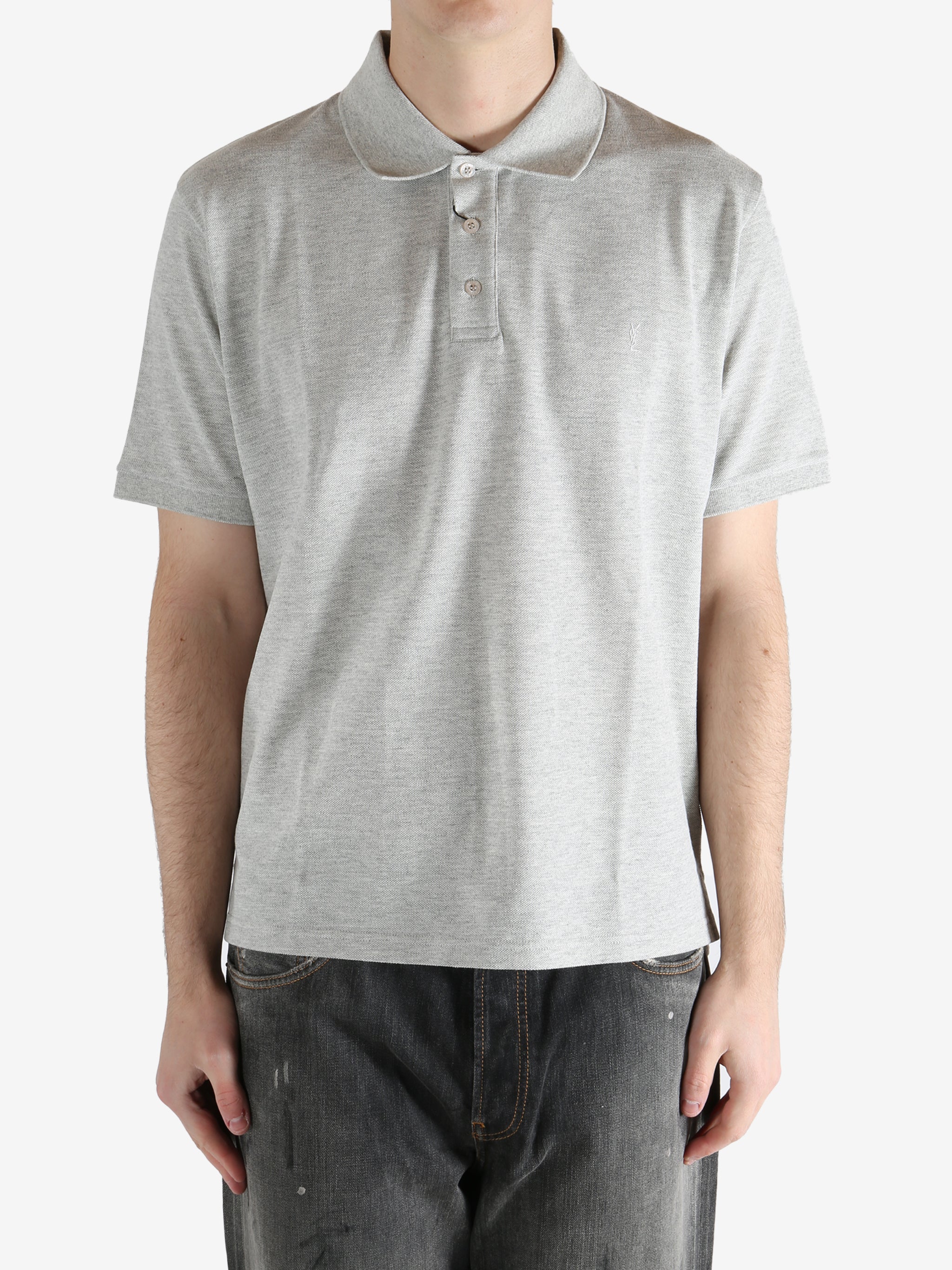 Grey shirt worn by a person, showing the shirt's fit