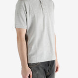 Grey shirt worn by a person, showing the shirt's fit