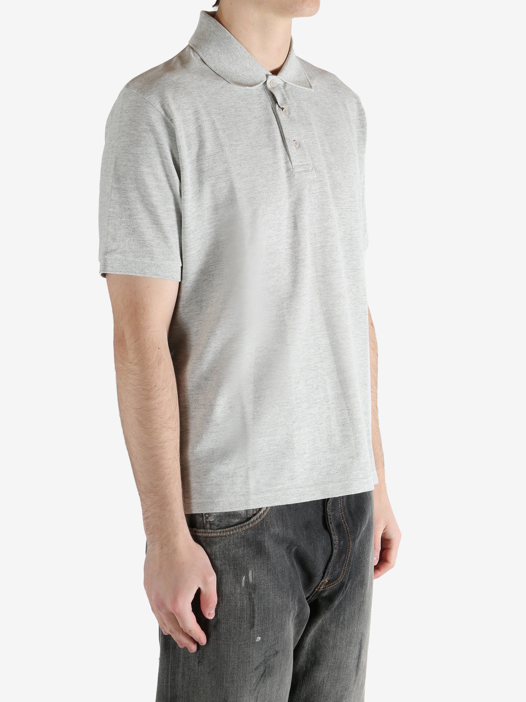 Grey shirt worn by a person, showing the shirt's fit