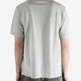 Grey shirt worn by a person, showing the shirt's fit