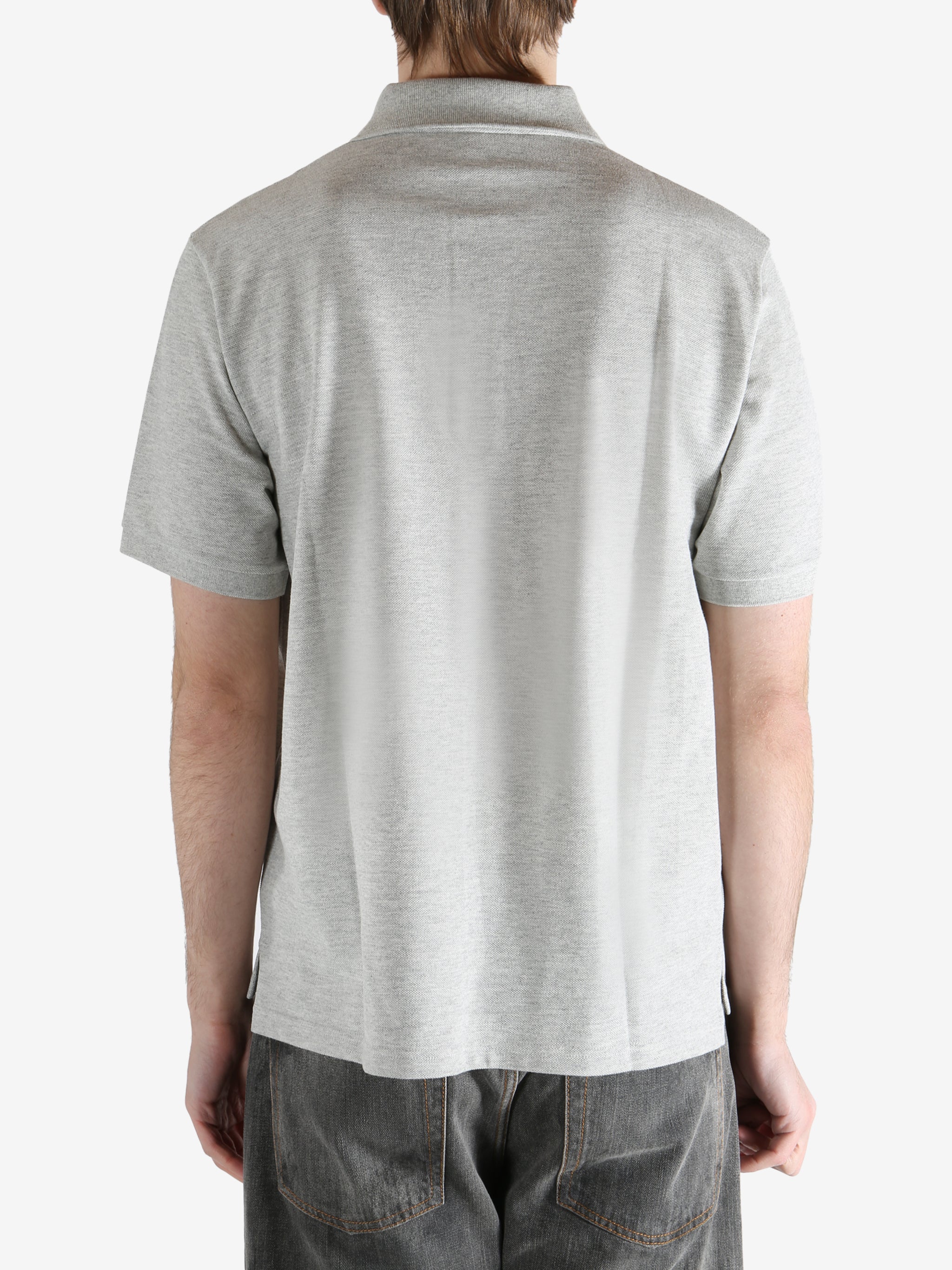 Grey shirt worn by a person, showing the shirt's fit