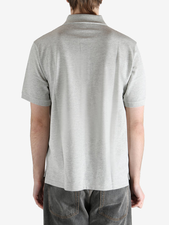 Grey shirt worn by a person, showing the shirt's fit