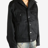 black jacket worn by a person, showing the jacket fit