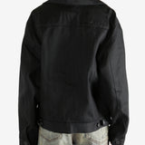 black jacket worn by a person, showing the jacket fit