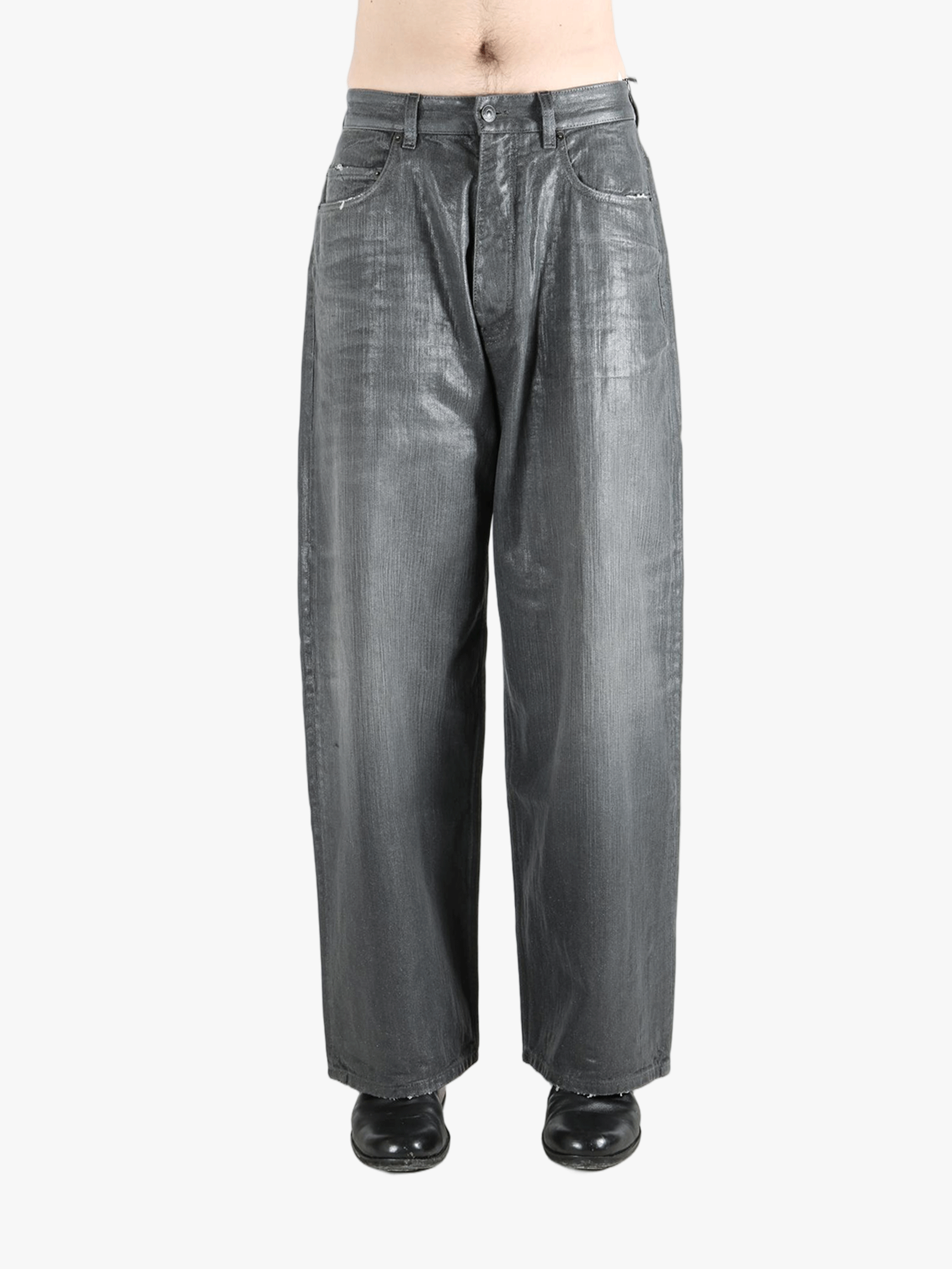 Grey pants worn by a person, showing the pants fit