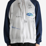 White hoodie worn by a person, showing the hoodie's fit