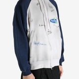 White hoodie worn by a person, showing the hoodie's fit