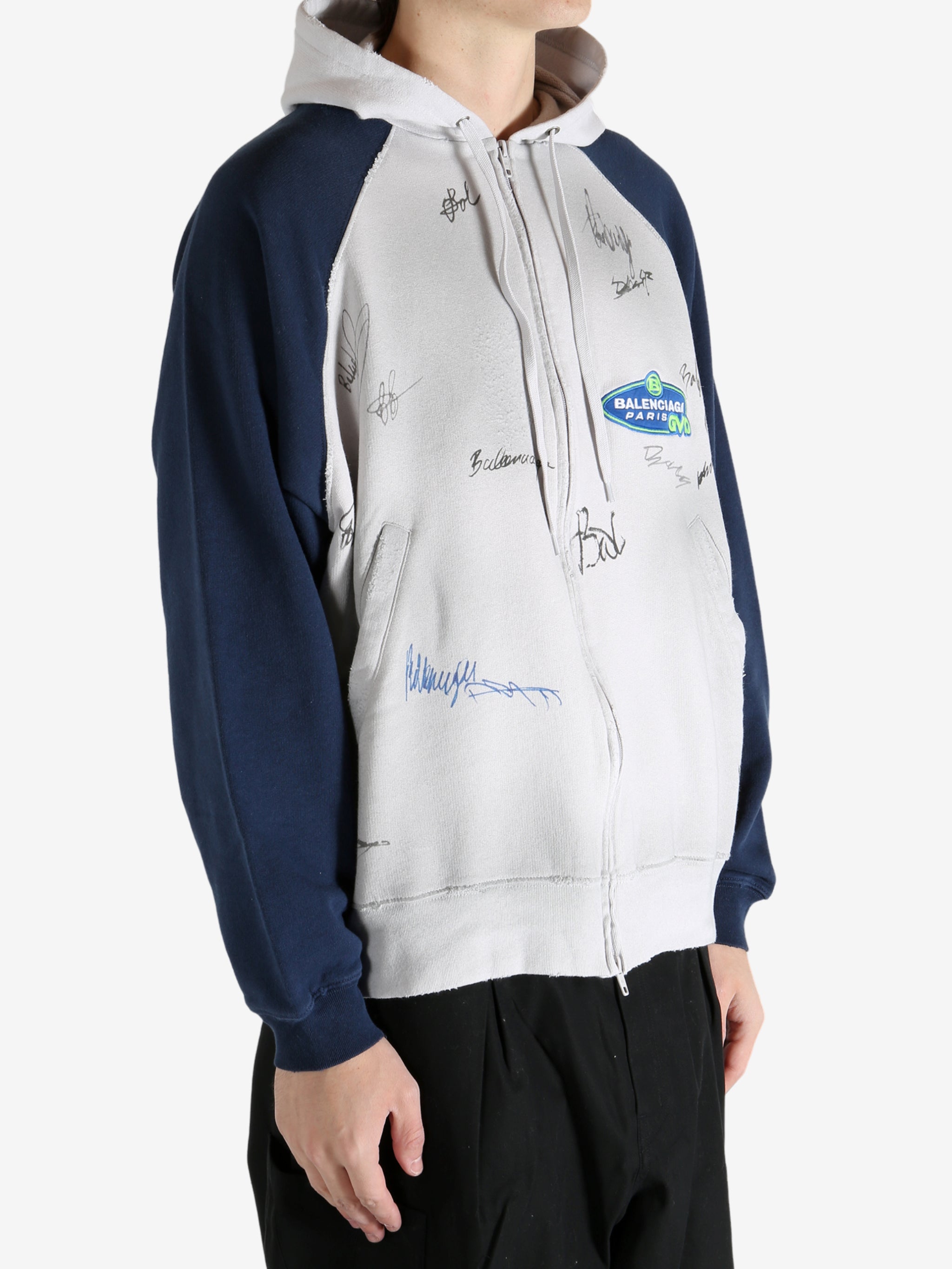 White hoodie worn by a person, showing the hoodie's fit