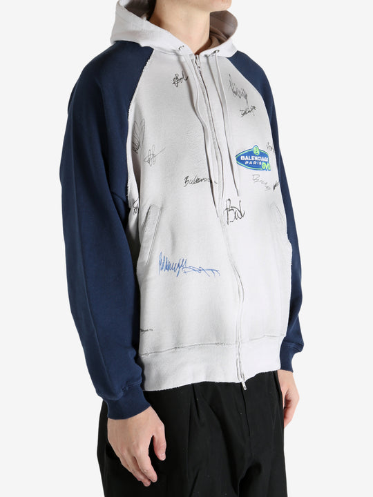 White hoodie worn by a person, showing the hoodie's fit