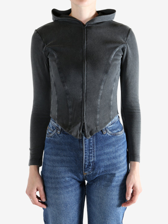 Black hoodie worn by a person, showing the hoodie's fit