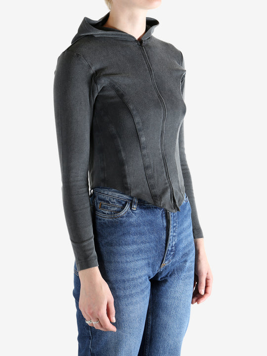 Black hoodie worn by a person, showing the hoodie's fit