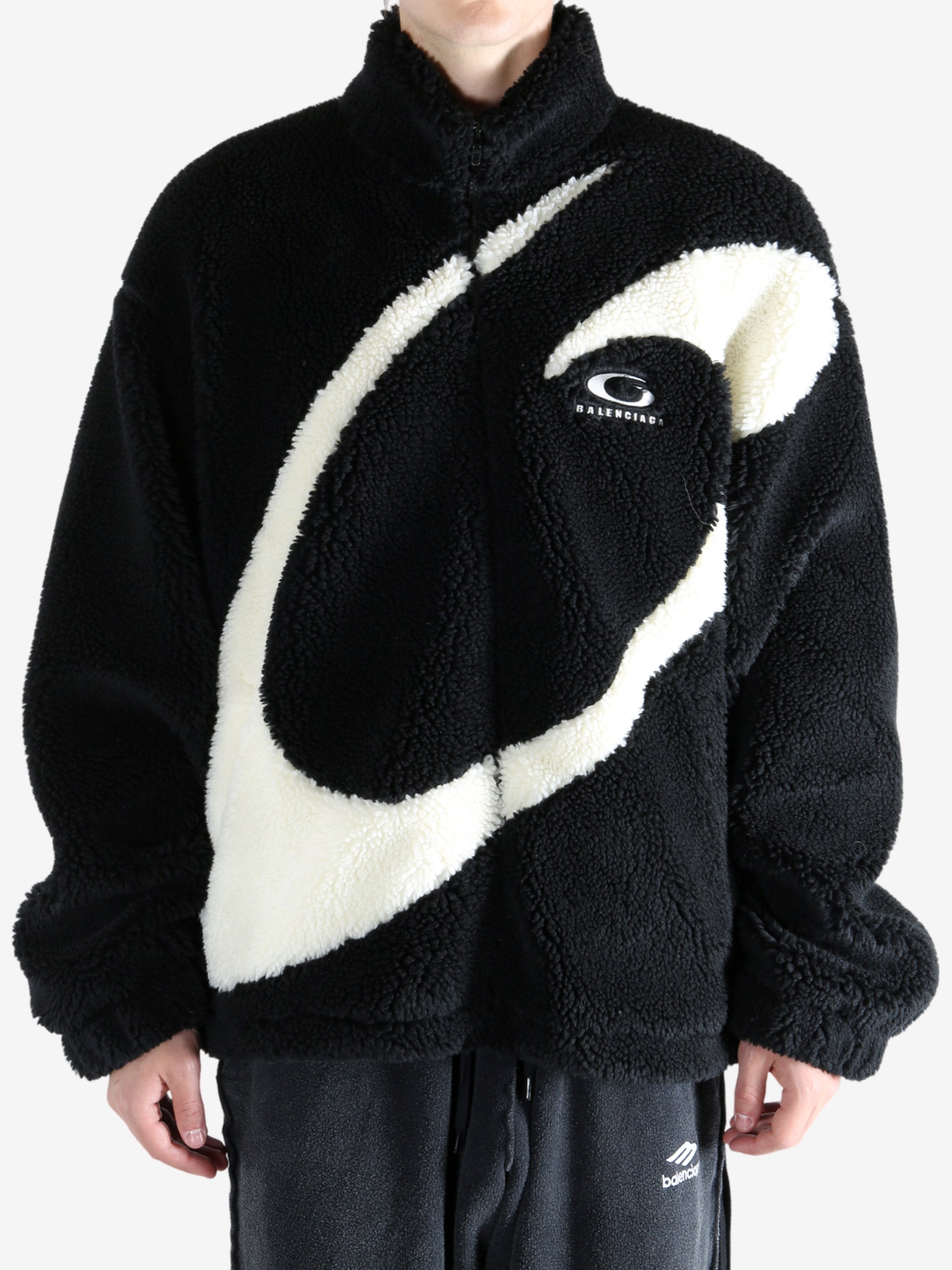 Black jacket worn by a person, showing the jacket's fit