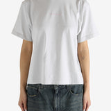 White t-shirt worn by a person, showing the shirt's fit