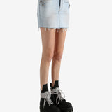 Blue skirt worn by a person, showing the skirt's fit