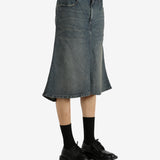 Blue skirts worn by a person, showing the skirt's fit