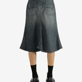 Blue skirts worn by a person, showing the skirt's fit