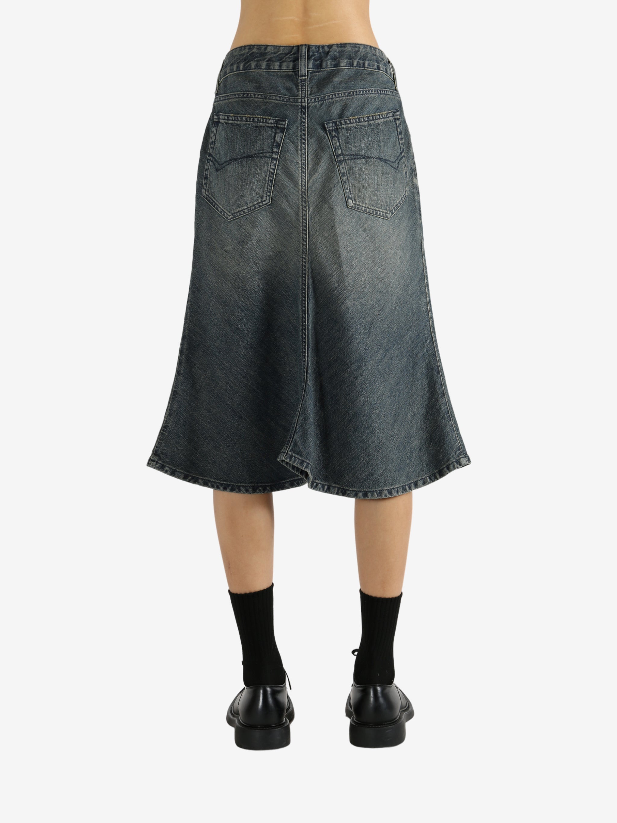 Blue skirts worn by a person, showing the skirt's fit