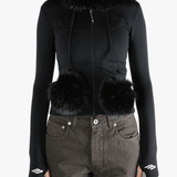 Black top  worn by a person, showing the top 's fit