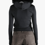 Black top  worn by a person, showing the top 's fit