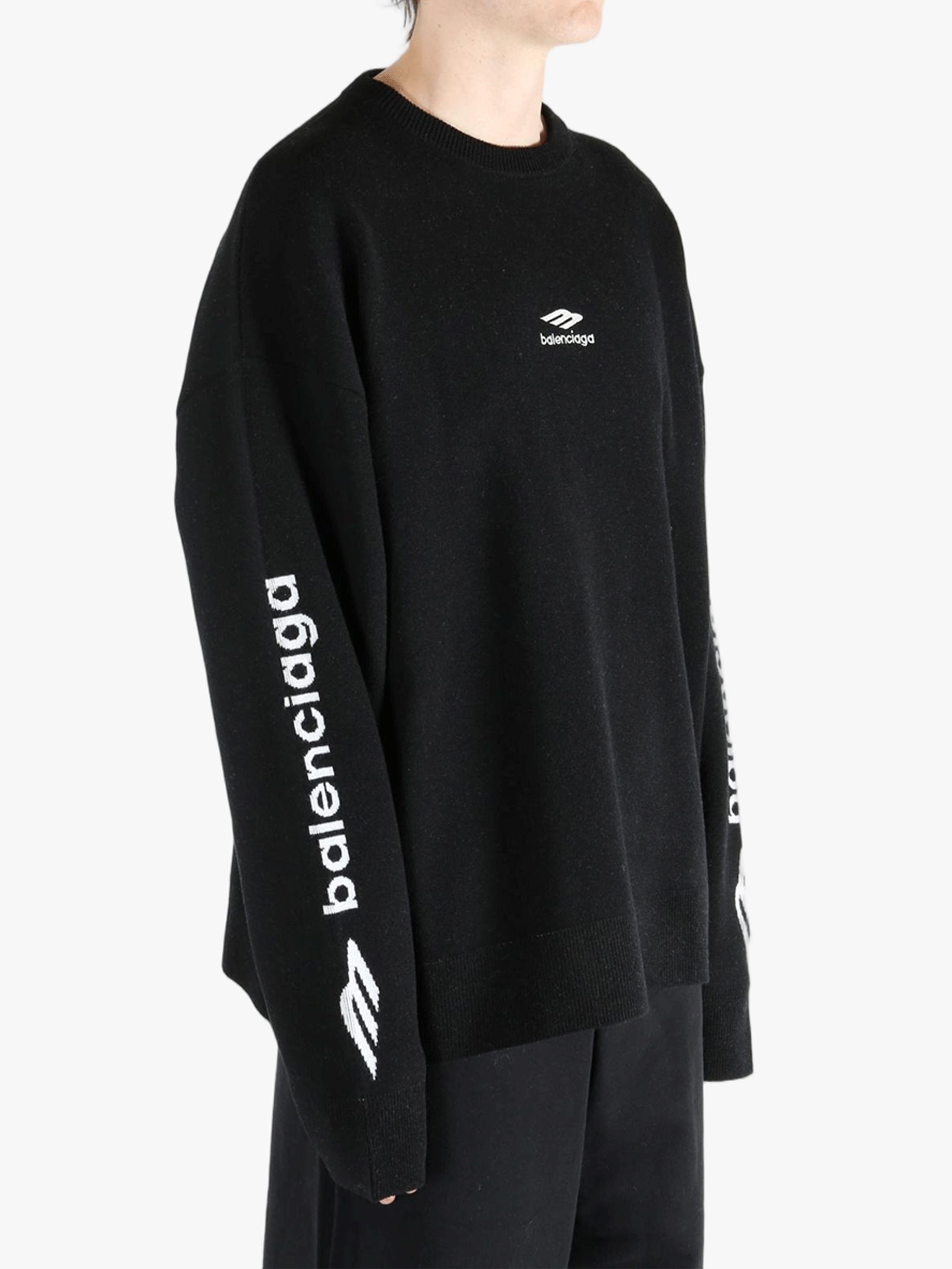 Black top worn by a person, showing the top's fit