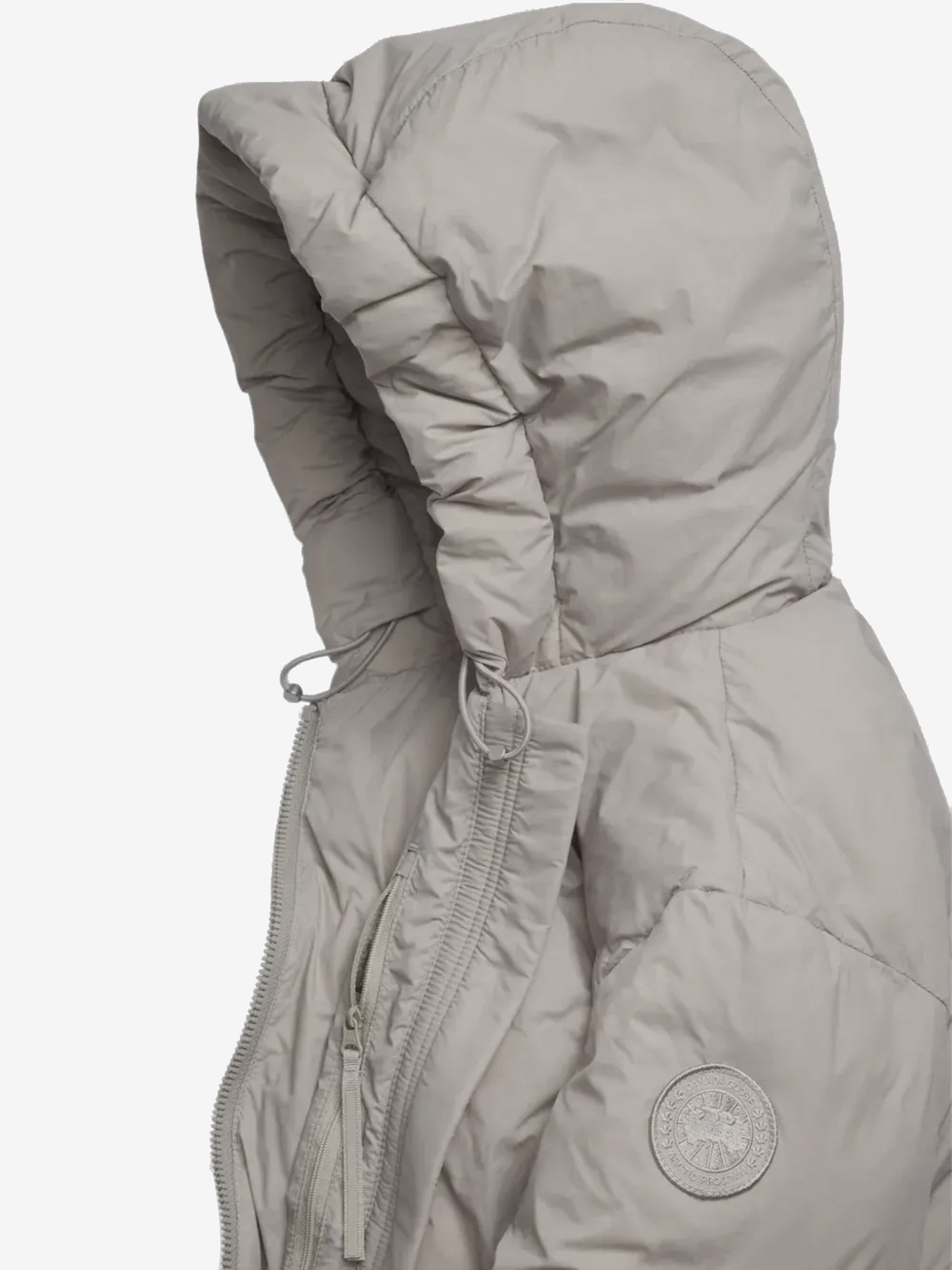 Close up of pink jacket,showing texture of the recycled polyamide fabric.