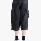Black pants worn by a person, showing the pants' fit