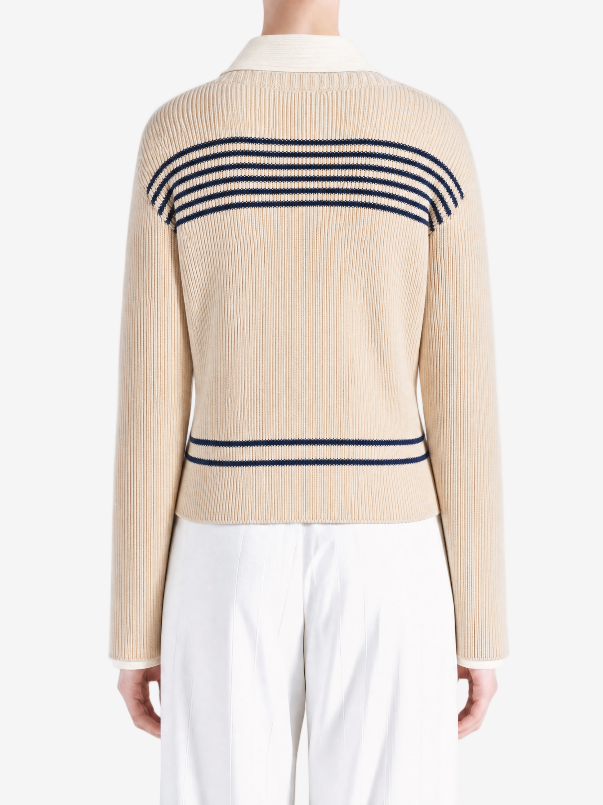 Tan knitwear worn by a person, showing the knitwear fit