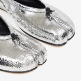 Close up of grey shoes, showing texture of the leather fabric