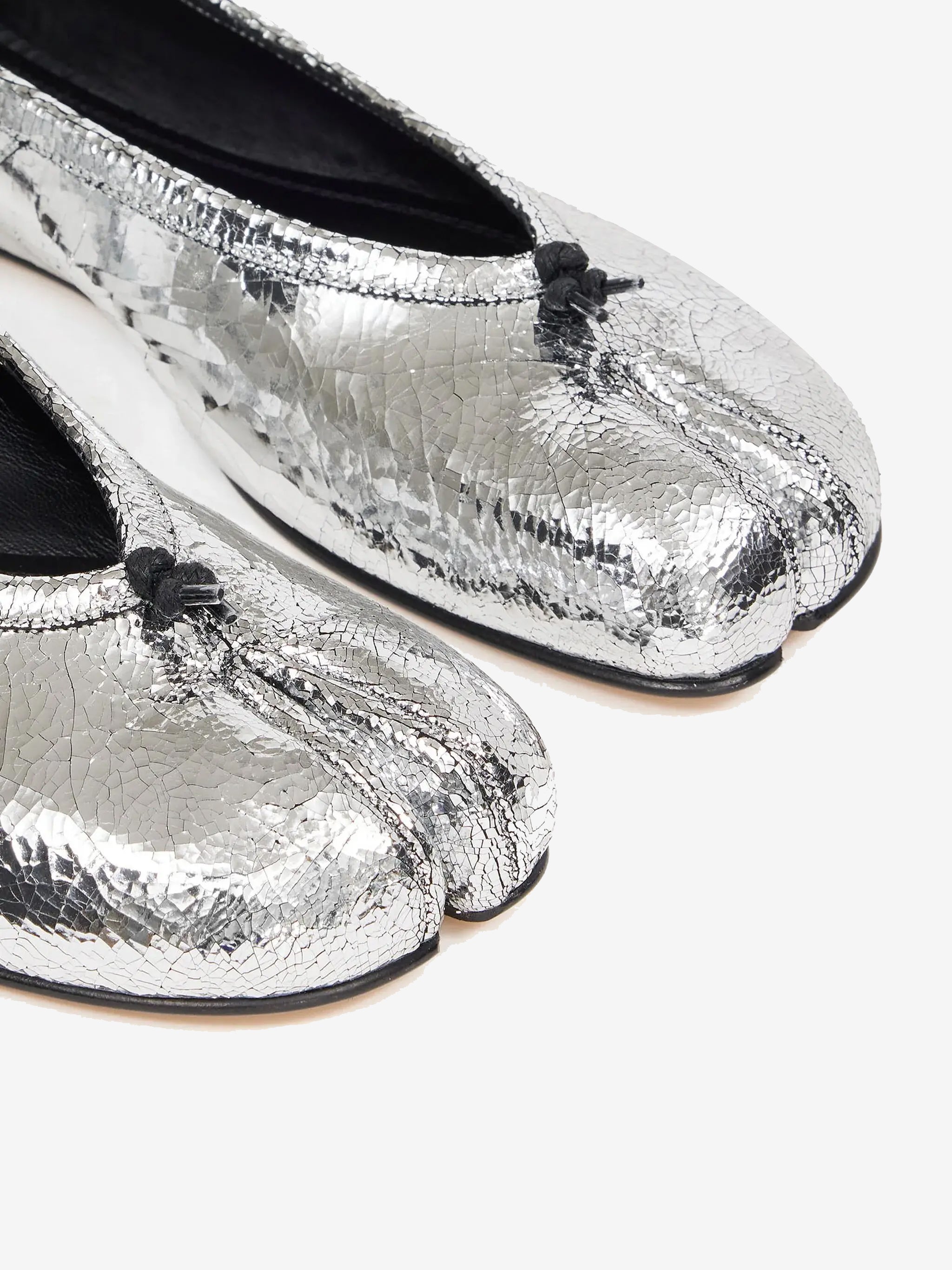 Close up of grey shoes, showing texture of the leather fabric