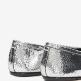 Close up of grey shoes, showing texture of the leather fabric