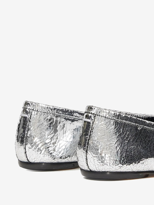 Close up of grey shoes, showing texture of the leather fabric