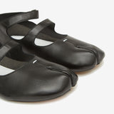 Close up of black shoes, showing texture of the leather fabric