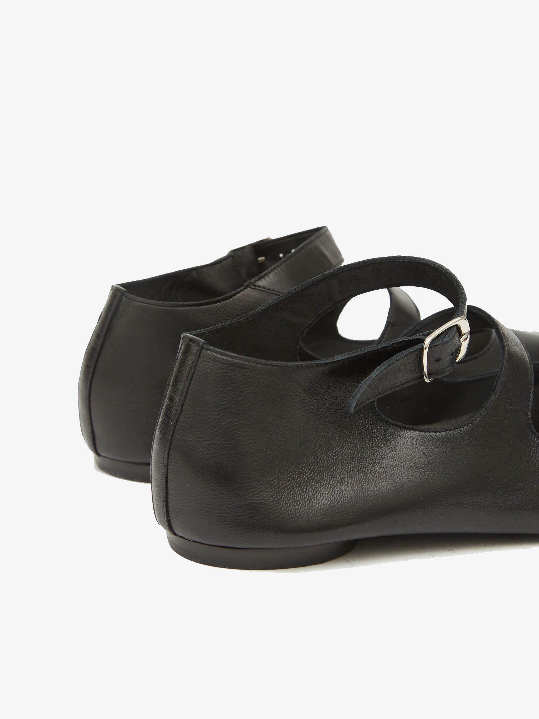 Close up of black shoes, showing texture of the leather fabric