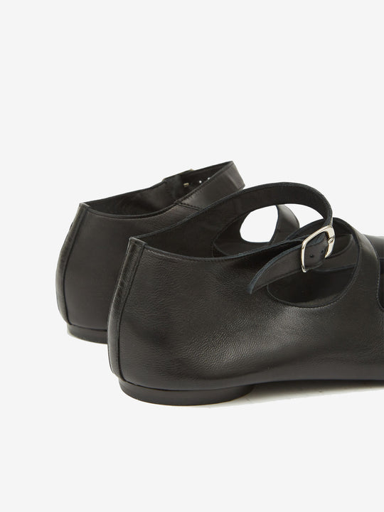 Close up of black shoes, showing texture of the leather fabric