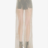 tan skirt worn by a person, showing the skirt  fit