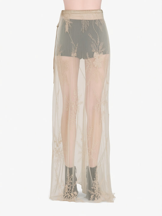 tan skirt worn by a person, showing the skirt  fit