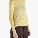 Yellow t-shirt worn by a person, showing the shirt's fit