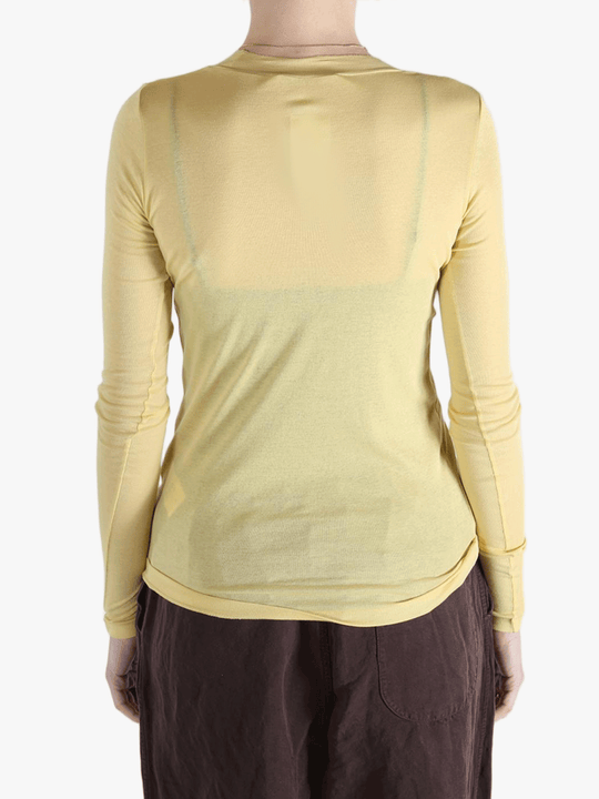 Yellow t-shirt worn by a person, showing the shirt's fit
