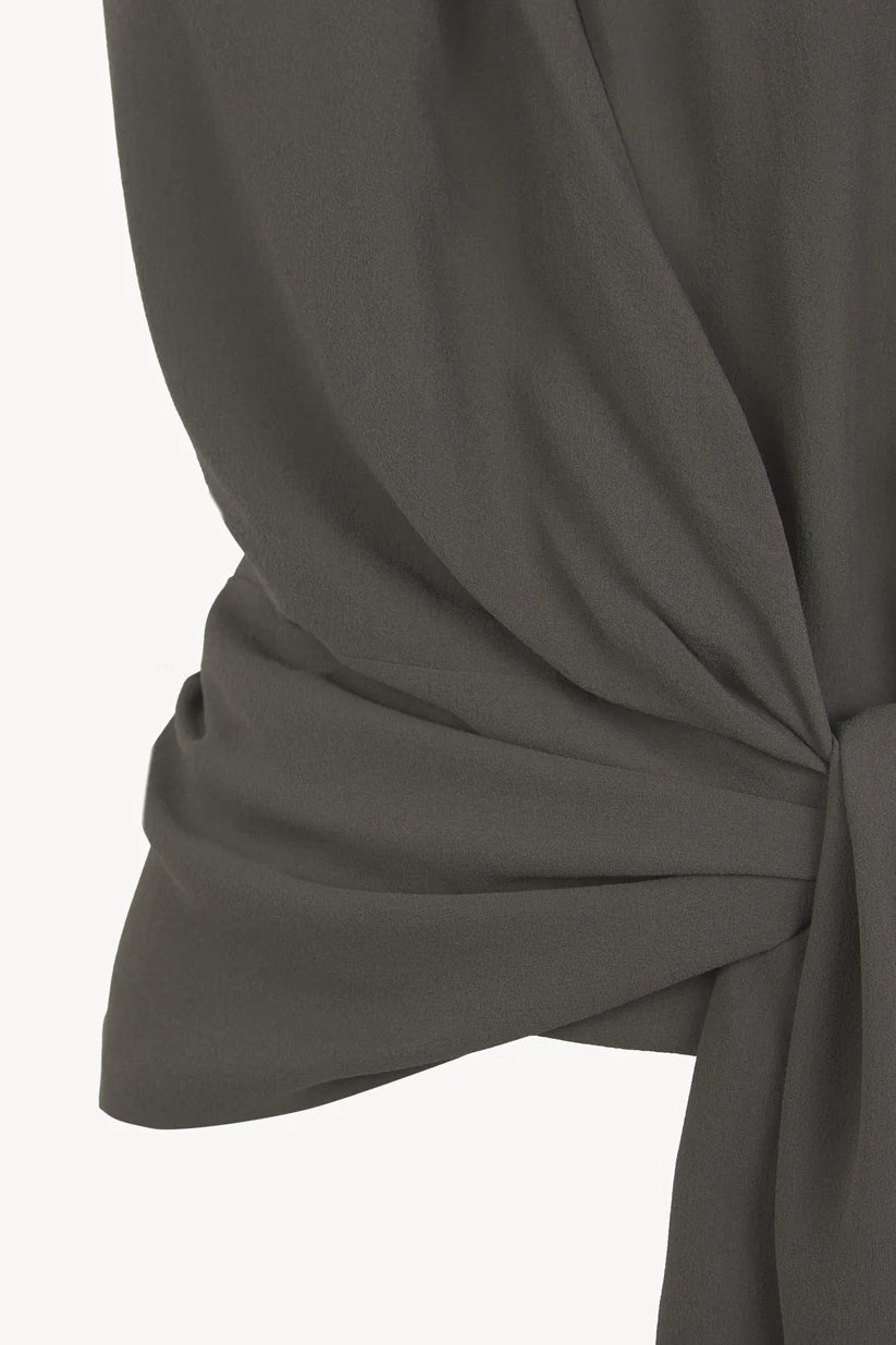 Close up of grey top, showing texture of the fabric