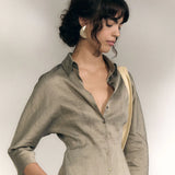 Grey shirts worn by a person, showing the shirts fit