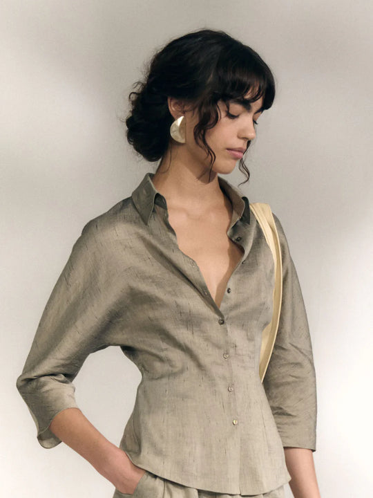 Grey shirts worn by a person, showing the shirts fit