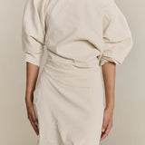 White top worn by a person, showing the top fit