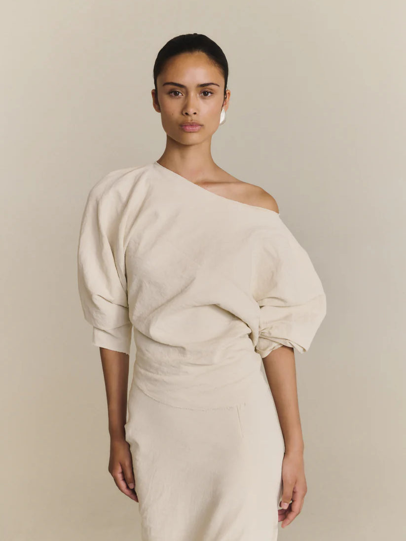 White top worn by a person, showing the top fit