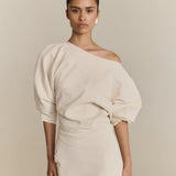 White top worn by a person, showing the top fit