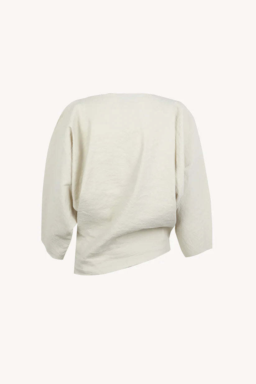 White top, back view