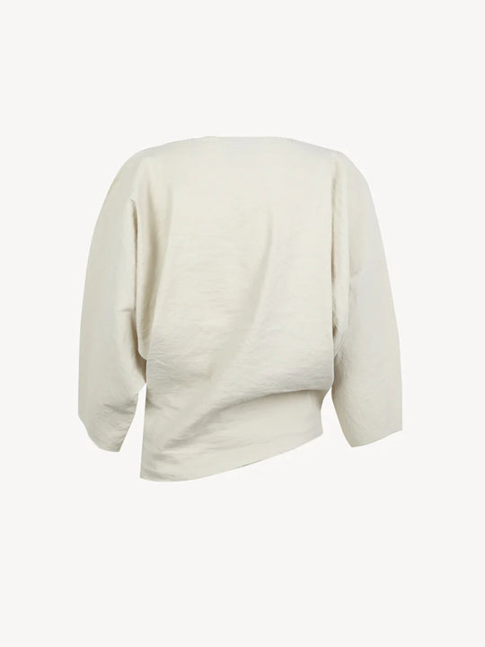 White top, back view