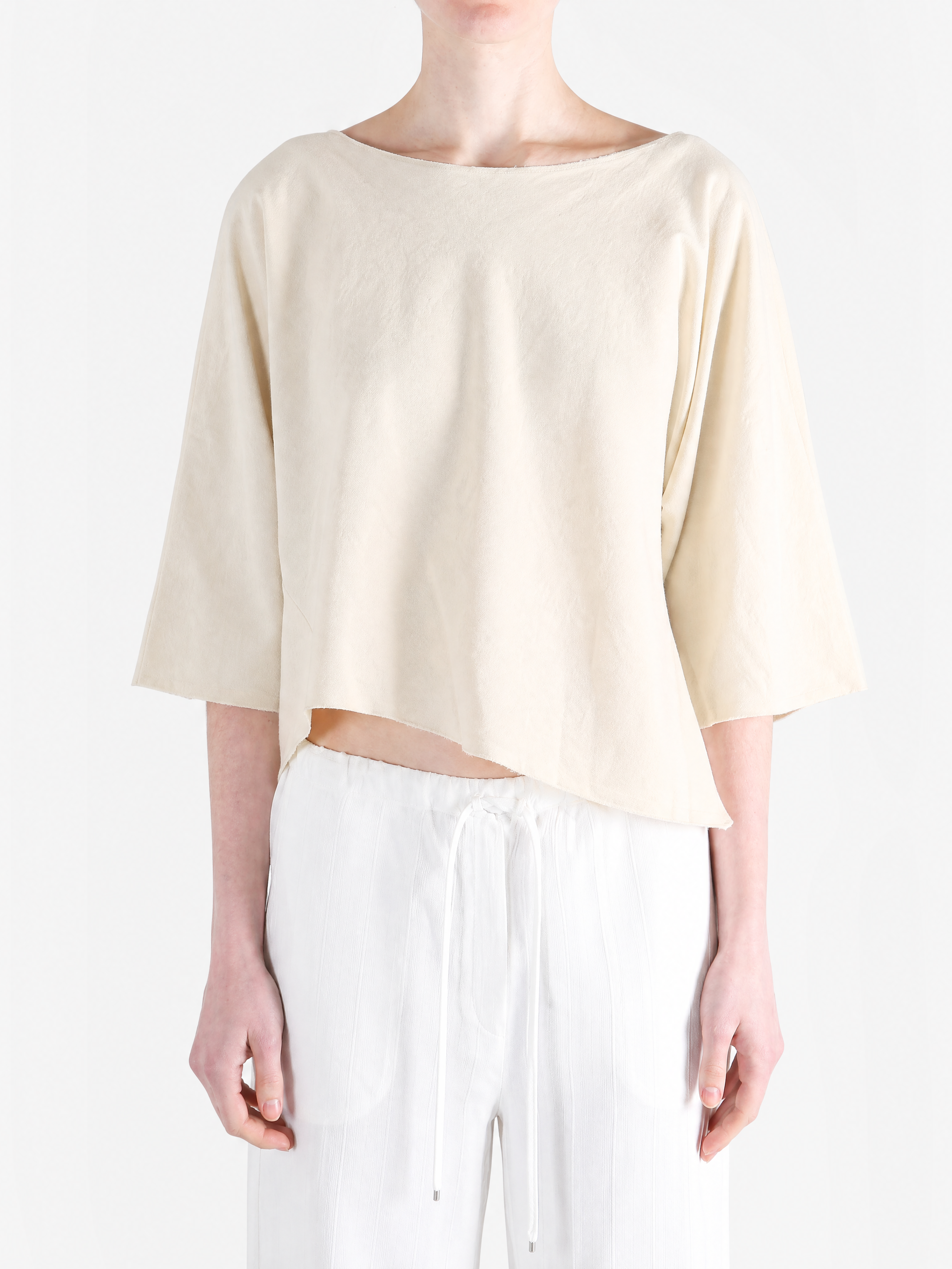 Tan top worn by a person, showing the top fit