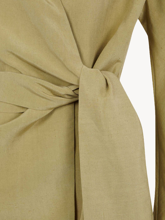 Close up of tan jacket, showing texture of the  Linen and Silk fabric