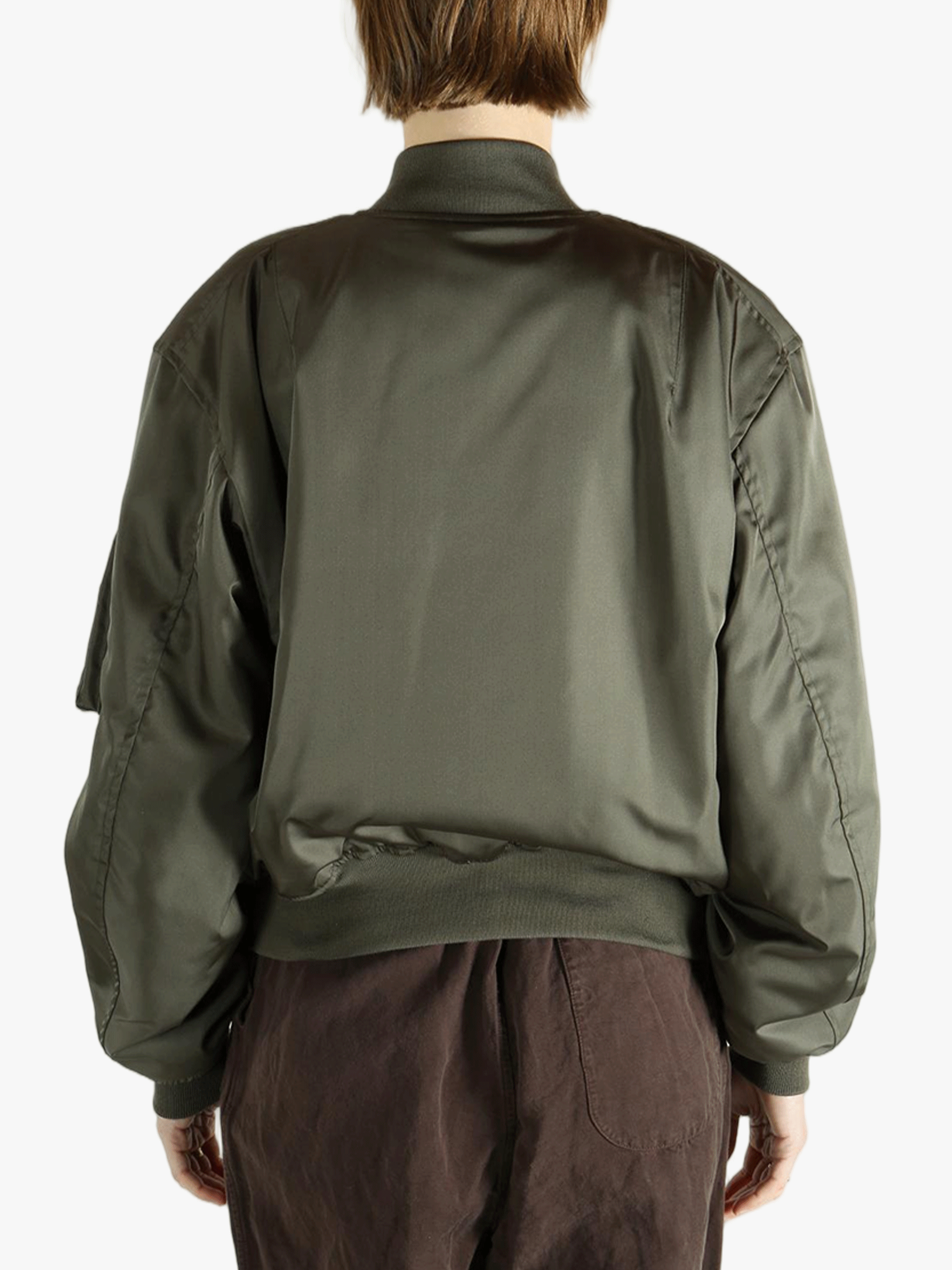 Green jackets-coats worn by a person, showing the jackets-coats's fit